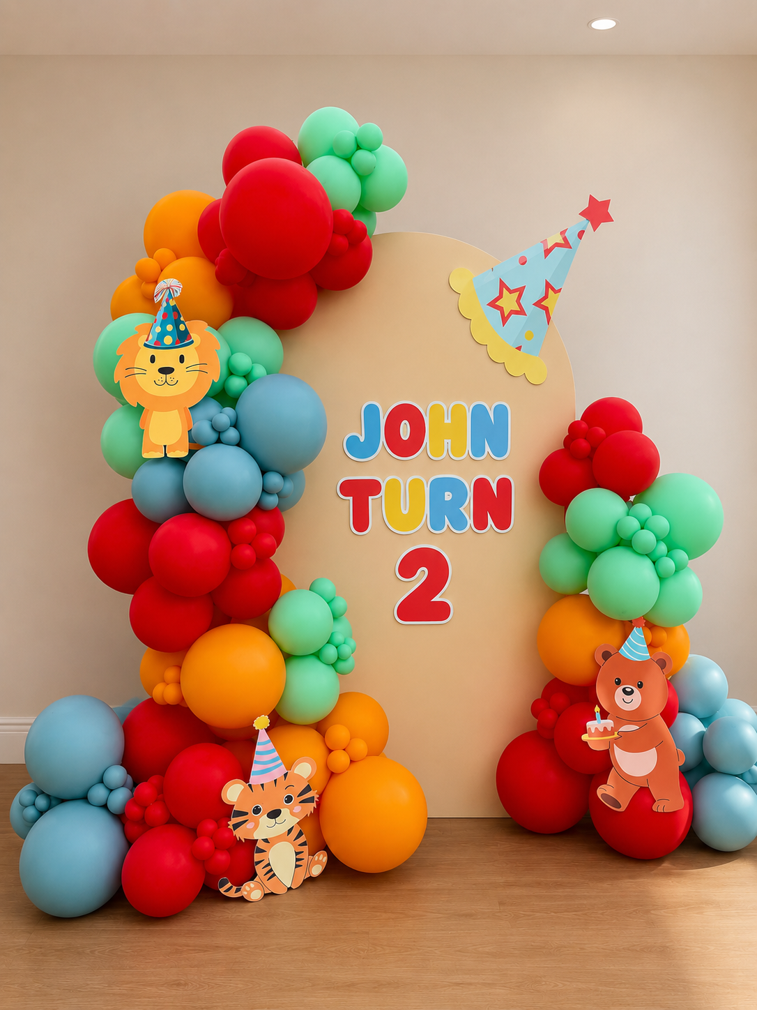 Red, blue, orange and green balloons framing a colorful second birthday backdrop
